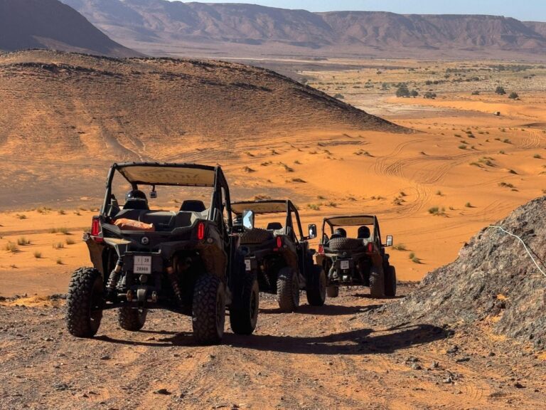 Motor Adventures off-road tour in Morocco with dune buggies driving across desert dunes and rocky trails